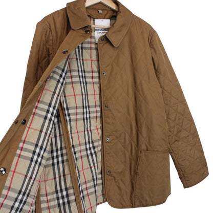 Burberry tan brown diamond quilted jacket with Nova Check lining and logo detail.