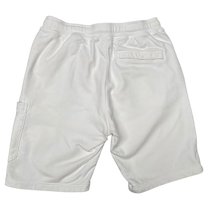 Stone Island white jogger shorts with logo patch and cotton material.