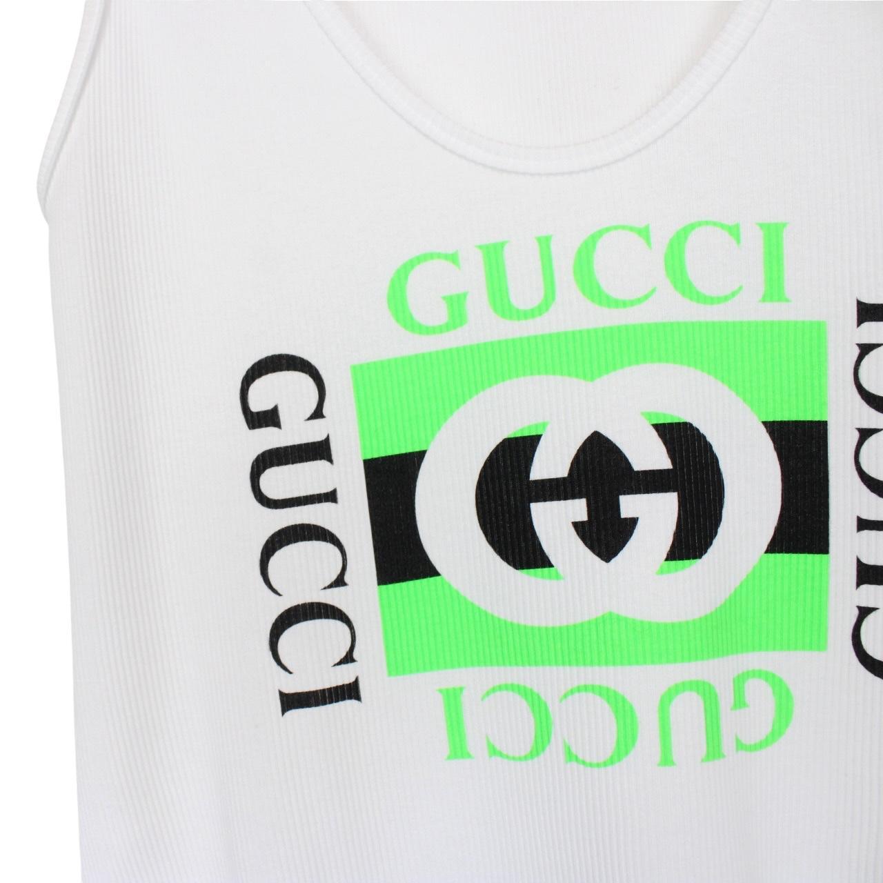 Gucci white tank top featuring bold logo print on soft cotton material.