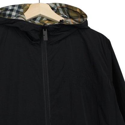 Burberry reversible nylon jacket in brown and black Nova Check pattern with logo.