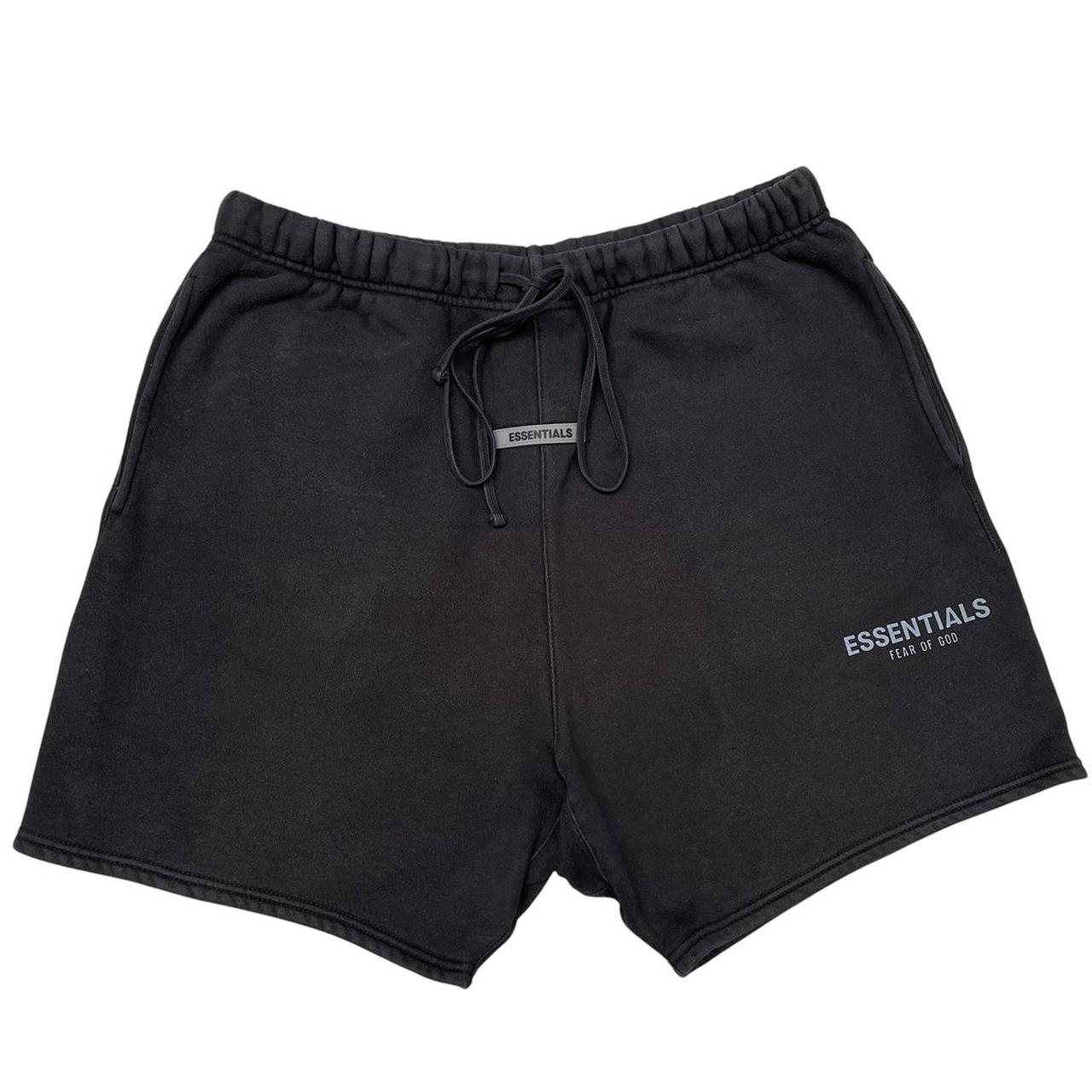 Essentials black jogger shorts cotton material with faded detailing and logo.