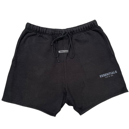 Essentials black jogger shorts cotton material with faded detailing and logo.