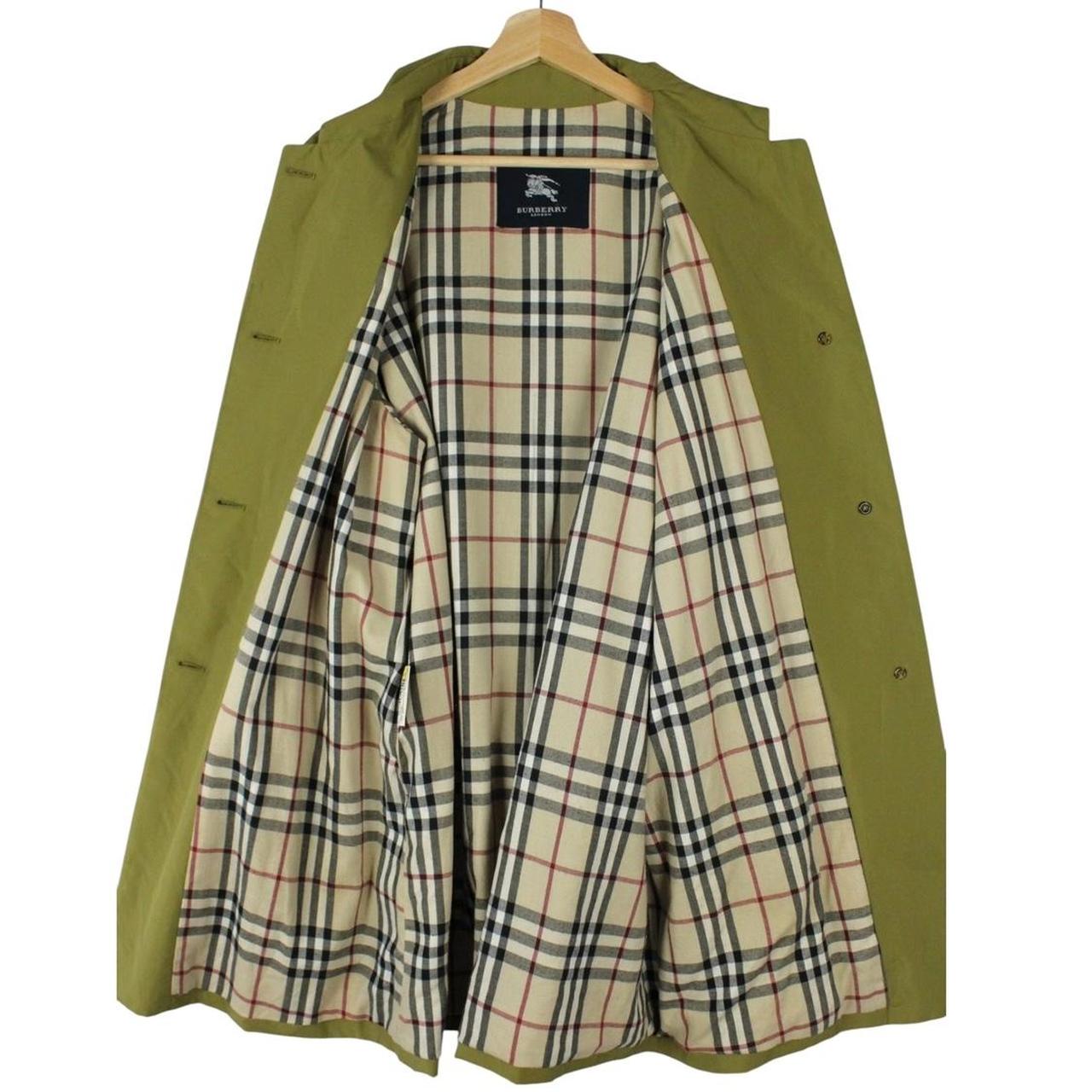 Burberry green trench coat with Nova Check pattern and belted waist detail.