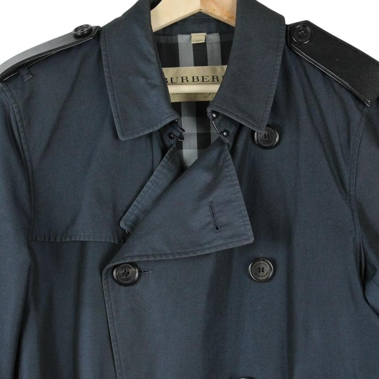 Burberry navy blue trench coat with Nova Check pattern and double-breasted design.