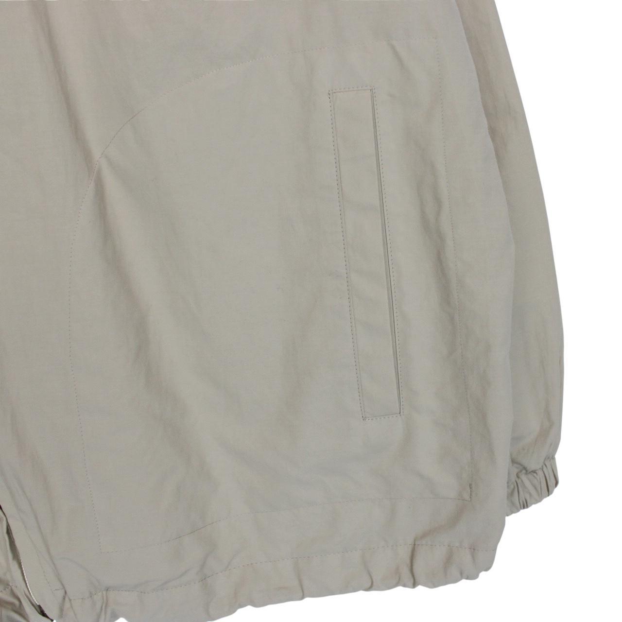 Burberry beige nylon jacket with Nova Check lining and full zip design.
