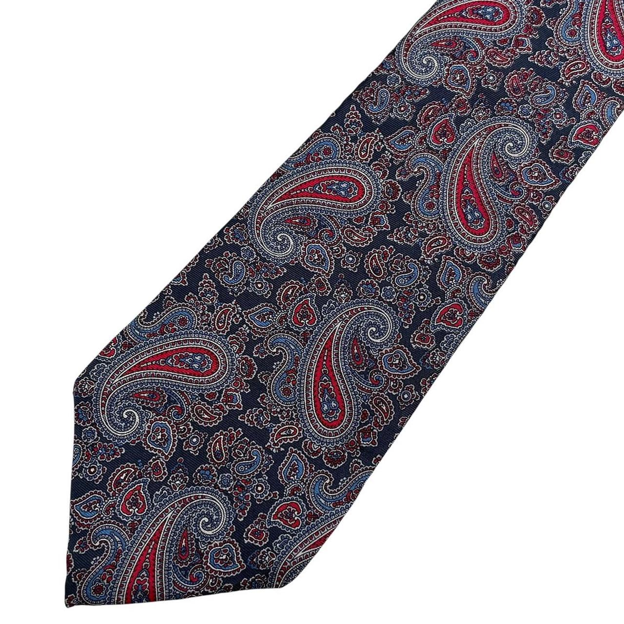Christian Dior multicoloured paisley silk tie with intricate pattern and smooth texture.