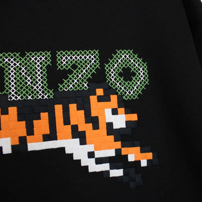 Kenzo black hoodie featuring digital tiger design and cotton material.