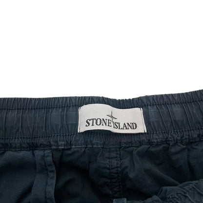 Stone Island navy blue cargo trousers with logo patch and multiple pockets.