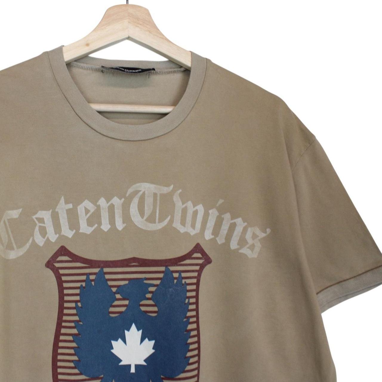 Dsquared2 tan brown pocket t-shirt featuring Caten twins print and cotton material.