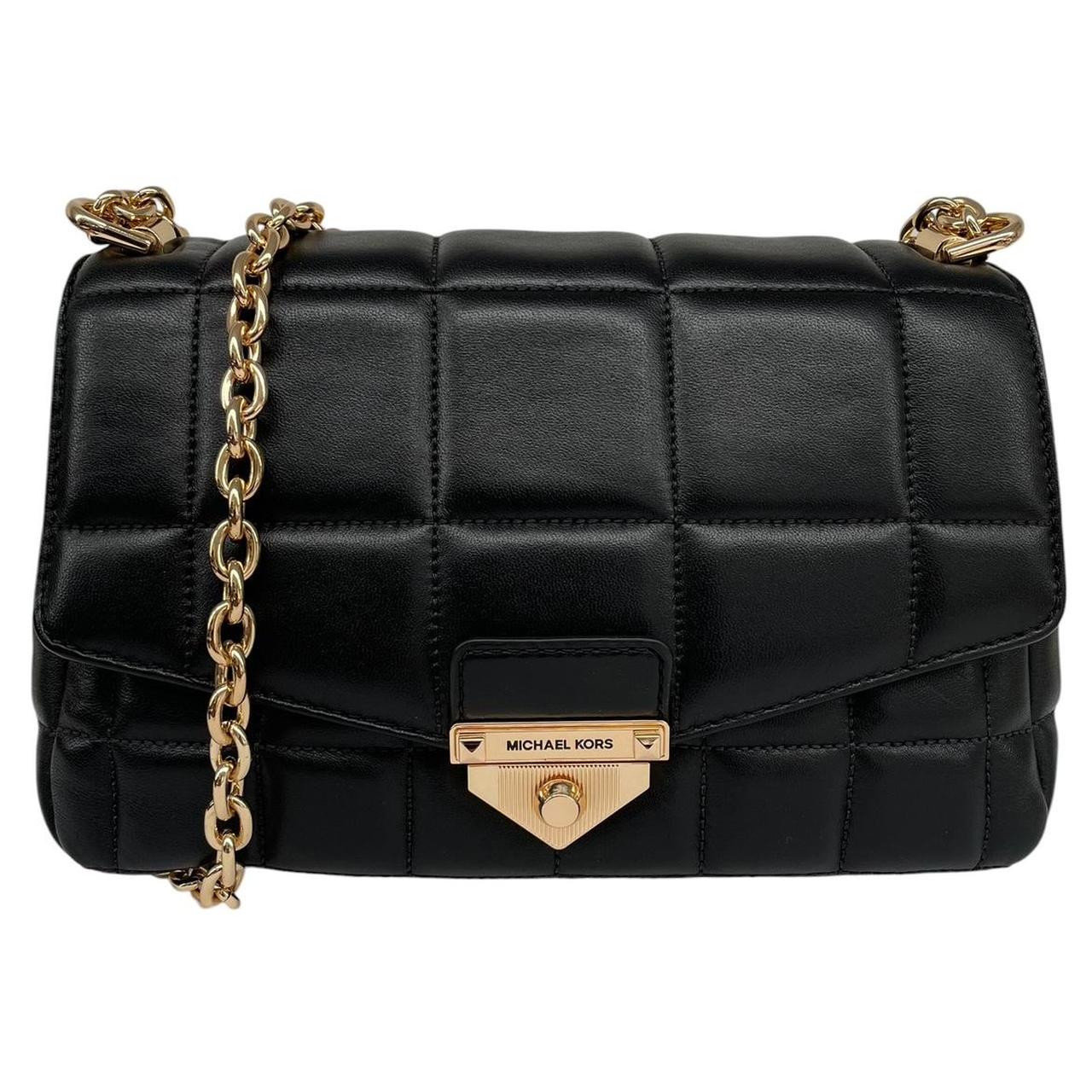 Michael Kors black duffel bag with quilted pattern and logo detail, pre-loved condition.