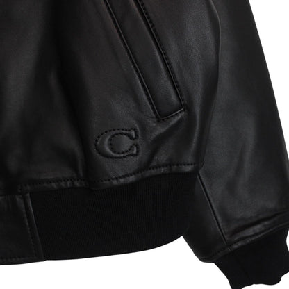Coach black lamb leather bomber jacket with full zip and brand logo.