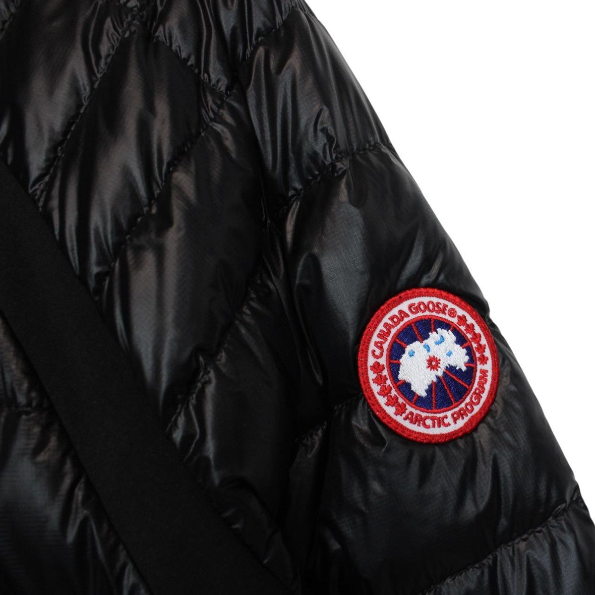 Canada Goose black down jacket with full zip and logo patch on sleeve.