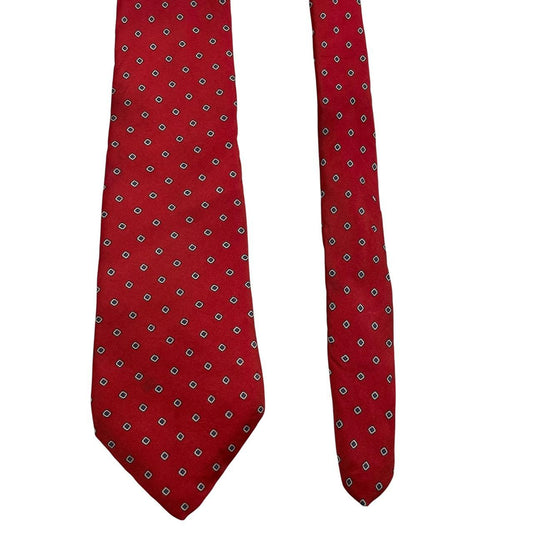 Yves Saint Laurent red silk tie with subtle sheen and vintage design.