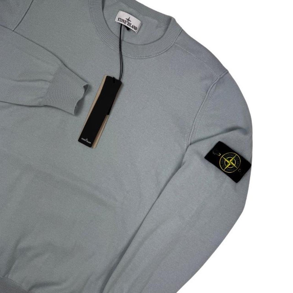 Stone Island grey knit jumper made from organic cotton with logo patch on sleeve.