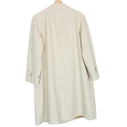 Burberry cream trench coat, single breasted, vintage 80s style, visible mark on sleeve.