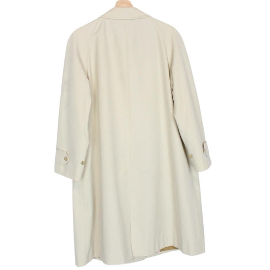 Burberry cream trench coat, single breasted, vintage 80s style, visible mark on sleeve.