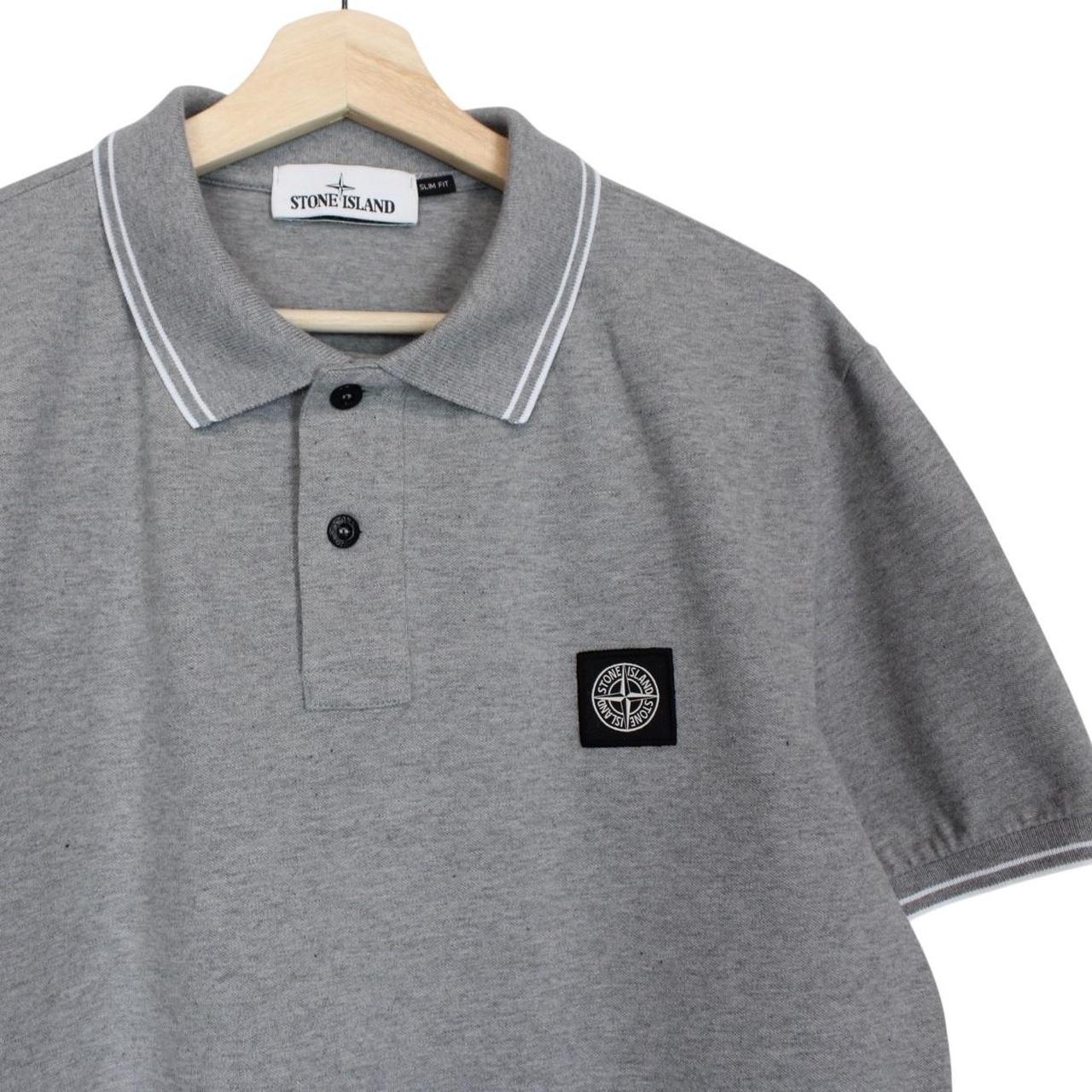 Stone Island grey polo shirt with embroidered compass logo and cotton material.