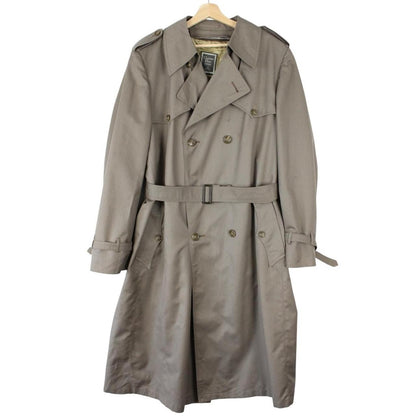 Christian Dior grey double breasted trench coat with removable wool lining and belted waist.