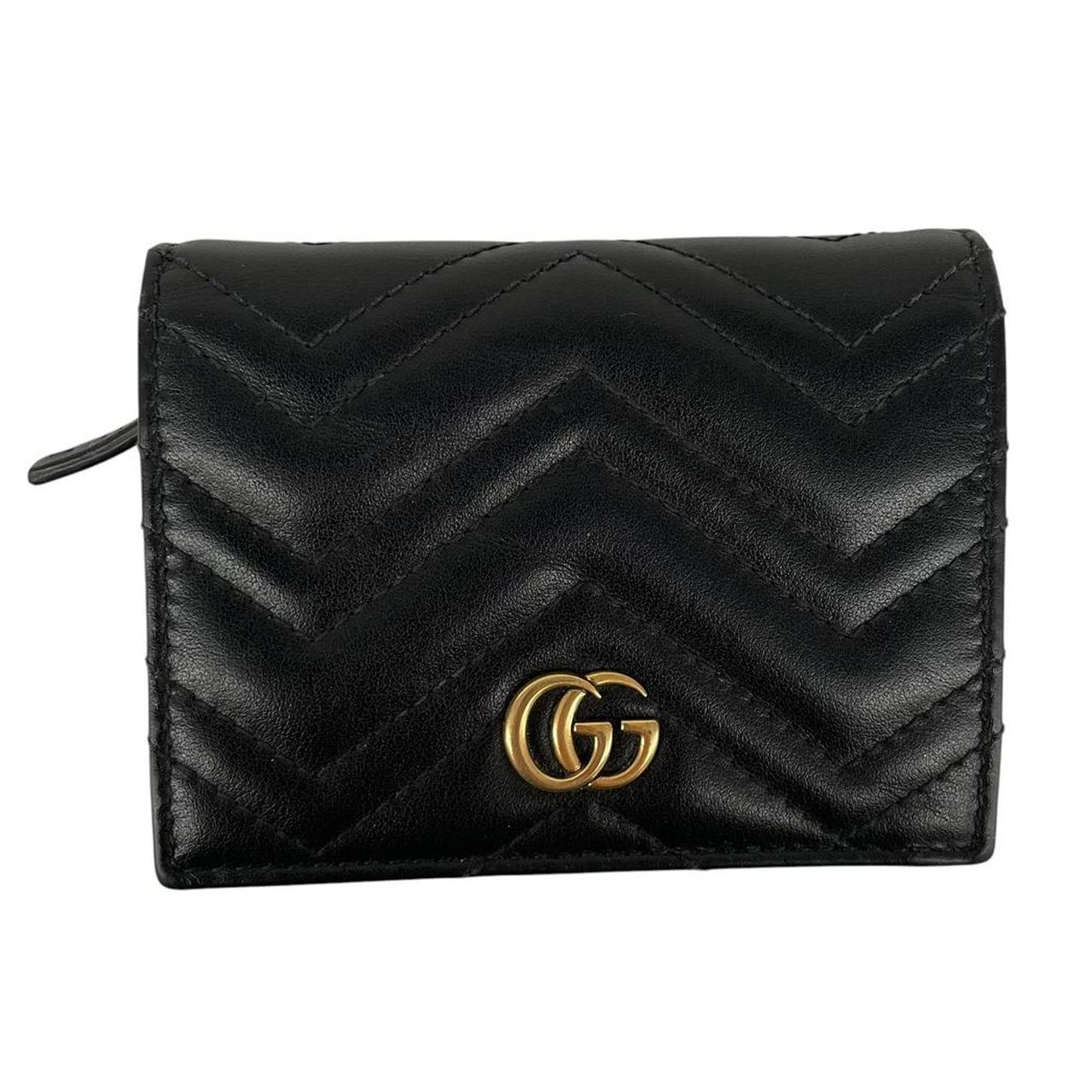 Gucci black calfskin card case wallet with matelasse pattern and GG logo.