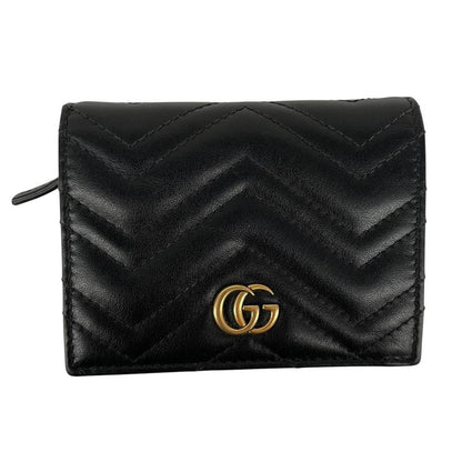 Gucci black calfskin card case wallet with matelasse pattern and GG logo.