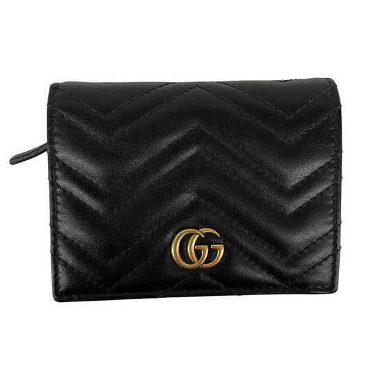 Gucci black calfskin card case wallet with matelasse pattern and GG logo.