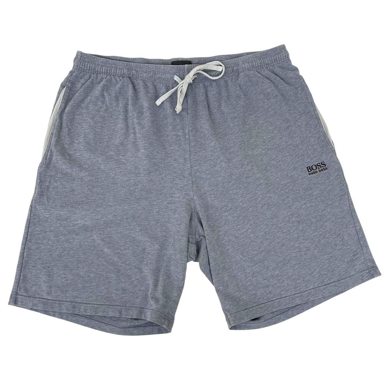 Hugo Boss blue jogger shorts with elastic waistband and logo detail.