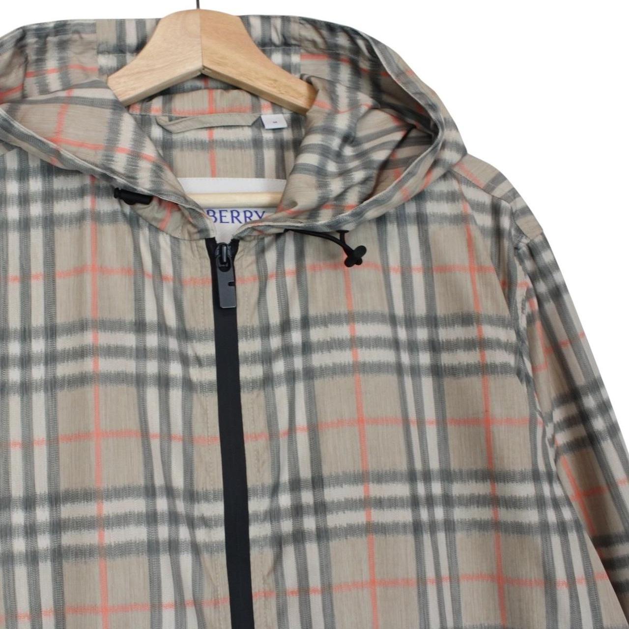 Burberry beige windbreaker jacket with Nova Check pattern and full zip hood.