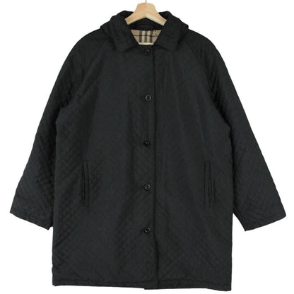 Burberry black quilted jacket with Nova Check lining and logo detail.