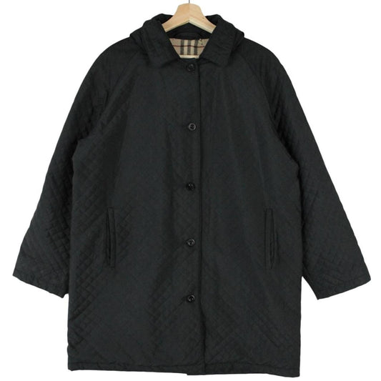 Burberry black quilted jacket with Nova Check lining and logo detail.