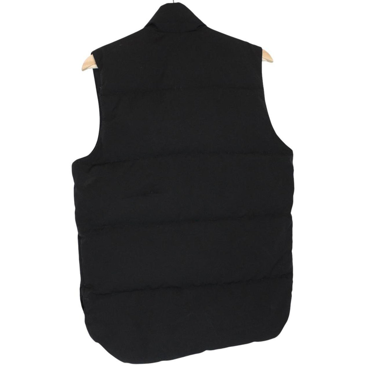 Canada Goose black down gilet with logo patch and durable exterior shell.