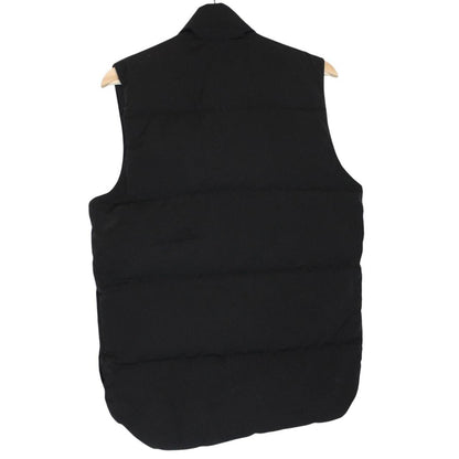 Canada Goose black down gilet with logo patch and durable exterior shell.