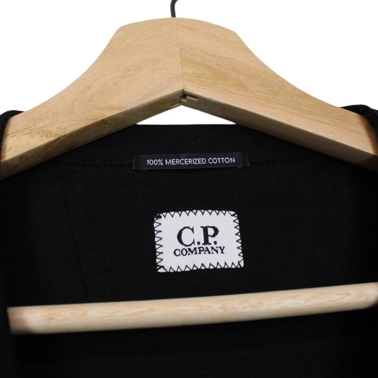 CP Company black pocket t-shirt with embroidered logo and mercerized cotton material.