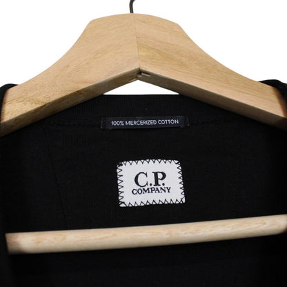 CP Company black pocket t-shirt with embroidered logo and mercerized cotton material.