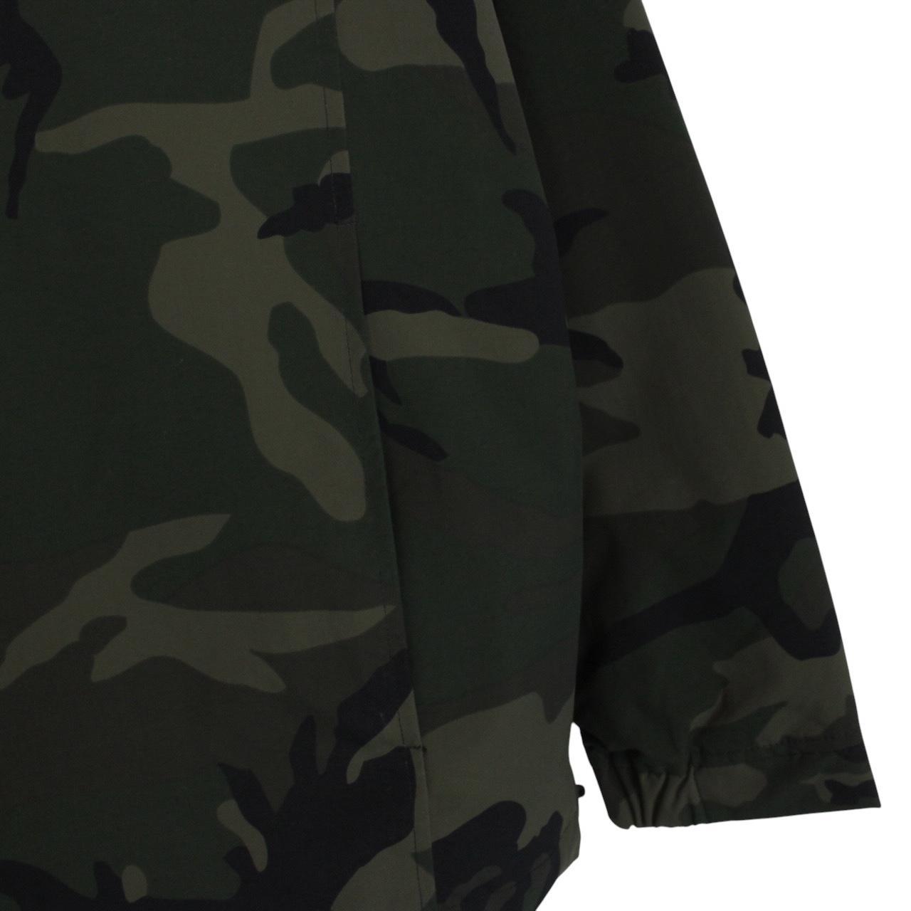 Carhartt camouflage hooded pullover jacket with logo and durable material.