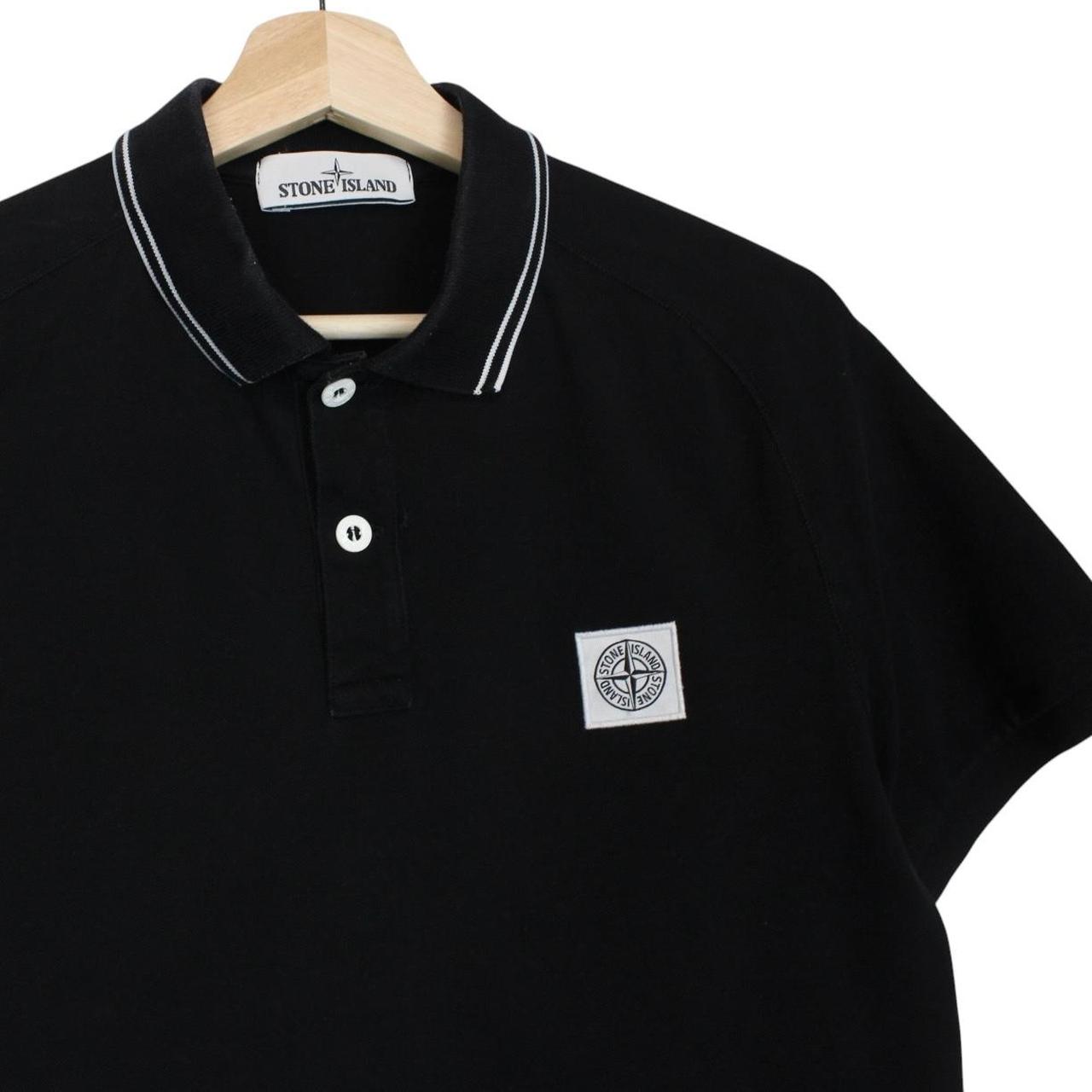 Stone Island black polo shirt with embroidered compass logo and cotton material.