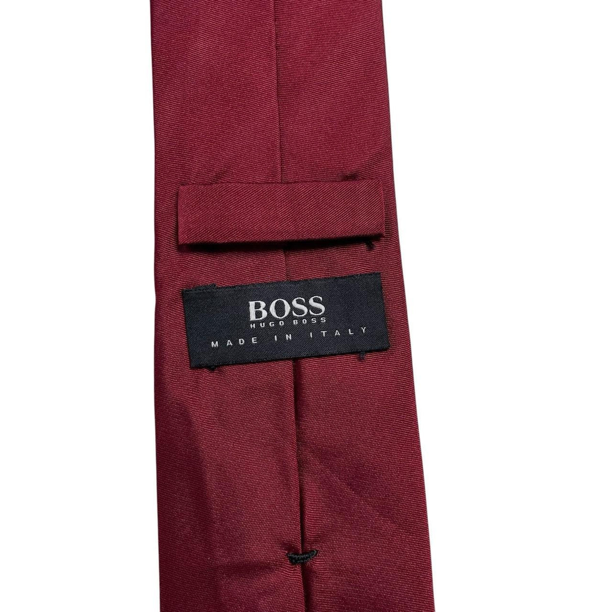 Hugo Boss burgundy silk tie with smooth texture and subtle sheen.