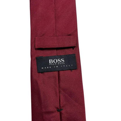 Hugo Boss burgundy silk tie with smooth texture and subtle sheen.