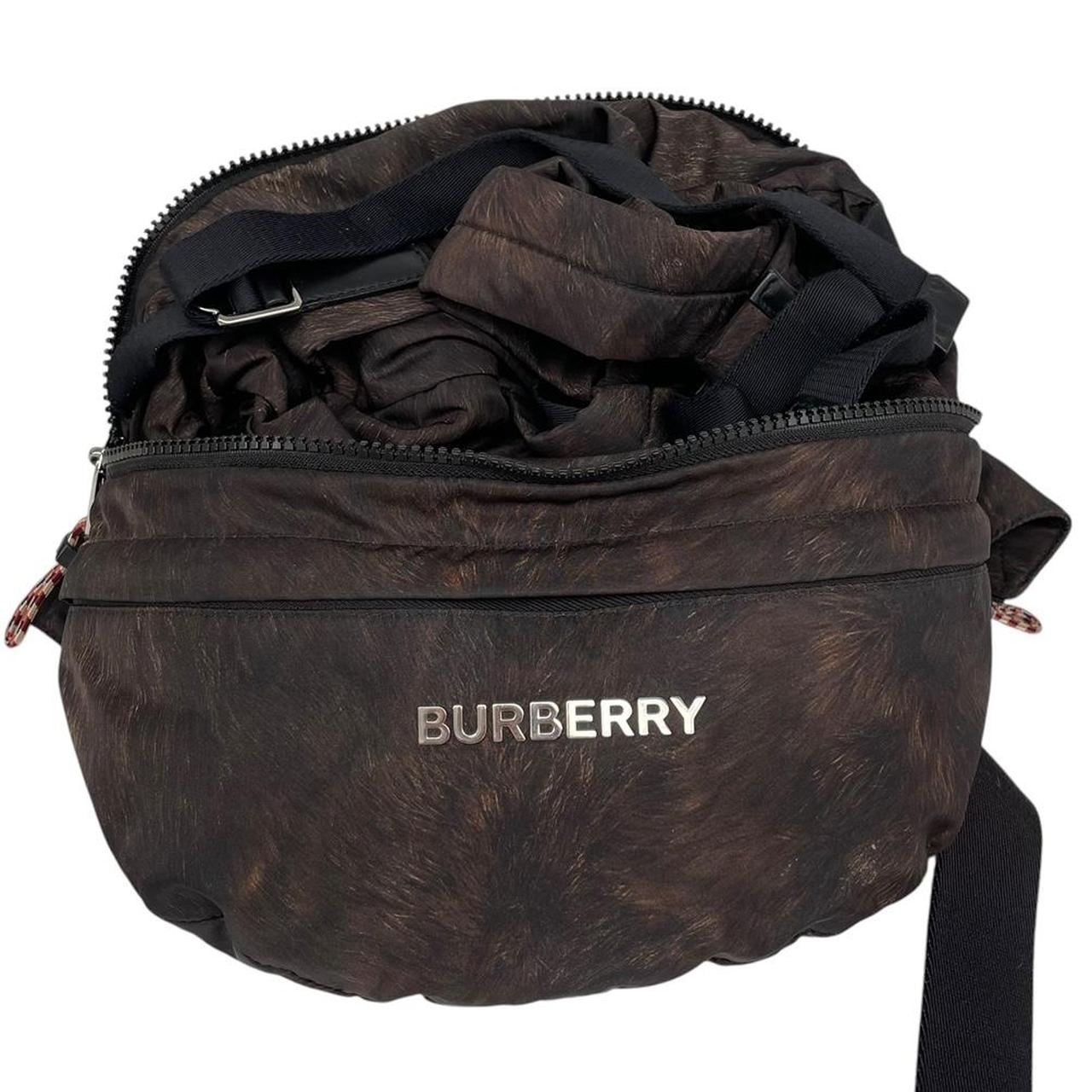 Burberry brown and black convertible bum bag with ape logo and durable material.