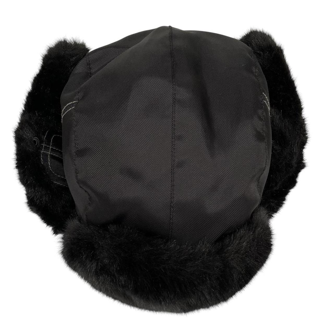 Paul Smith black nylon trapper hat with tags, featuring classic design and logo details.