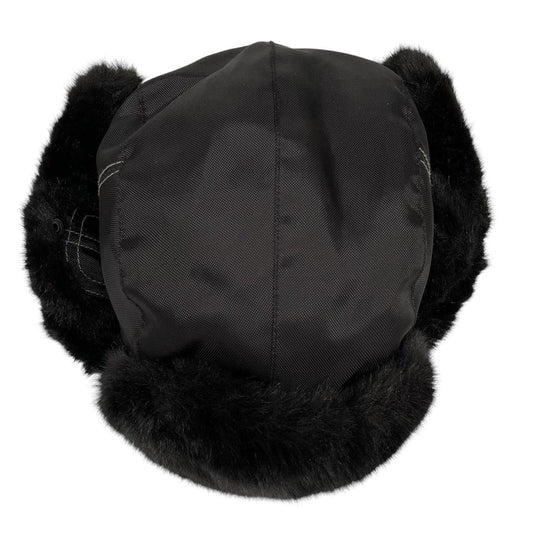 Paul Smith black nylon trapper hat with tags, featuring classic design and logo details.