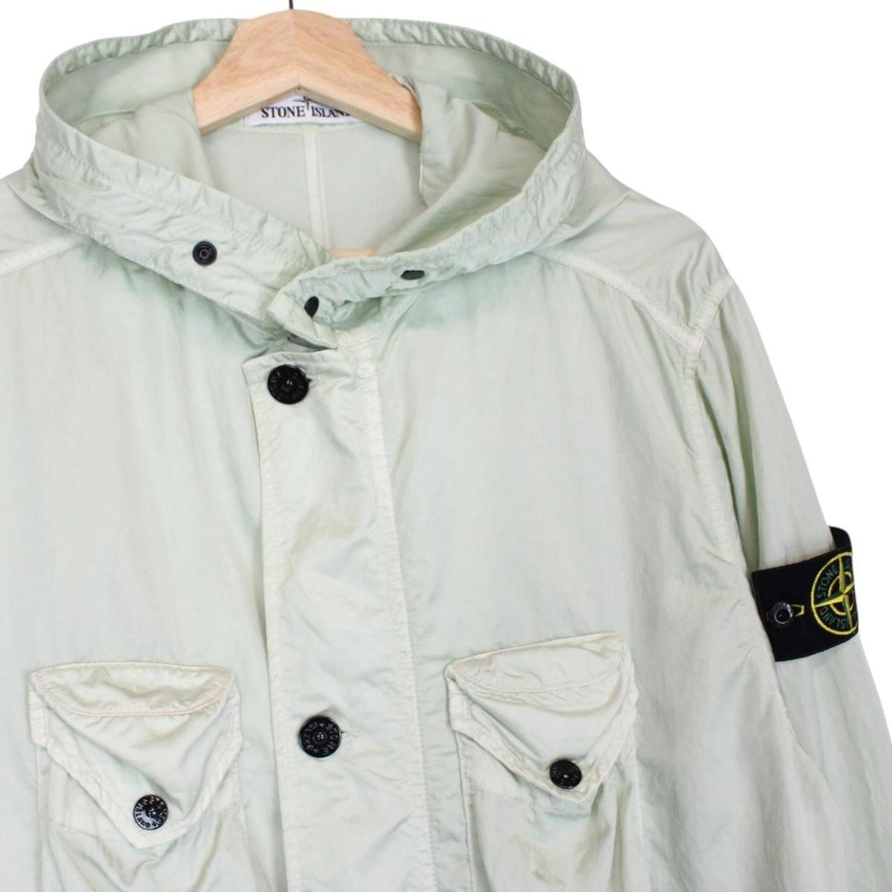 Stone Island mint green multi pocket jacket with logo patch and nylon material.