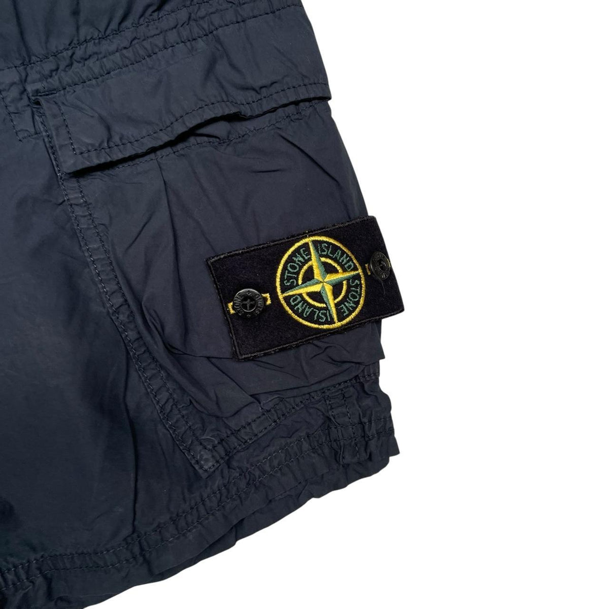 Stone Island navy blue cargo shorts with logo patch and cotton material.