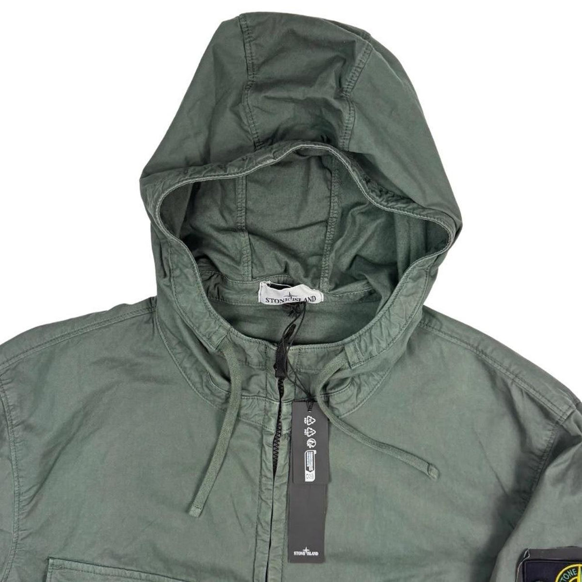 Stone Island green hooded jacket with full zip, Supima cotton twill material, logo patch.