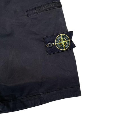 Stone Island navy blue cargo shorts with logo patch and faded cotton material.
