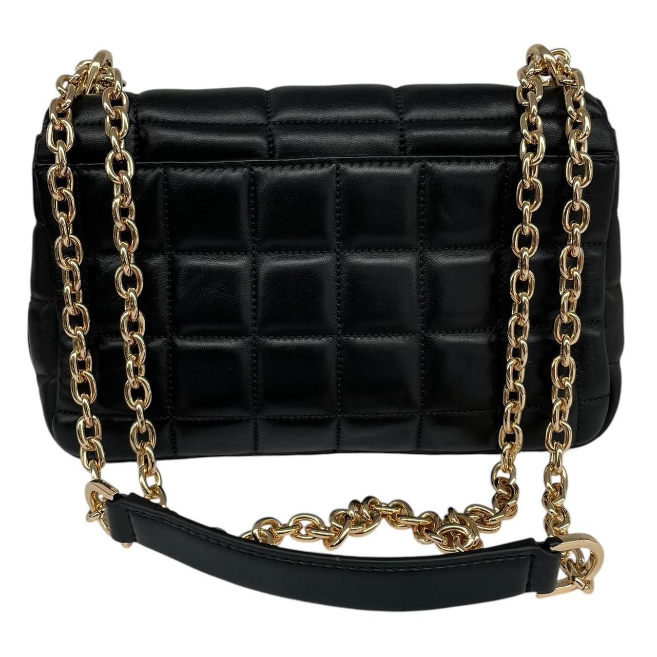 Michael Kors black duffel bag with quilted pattern and logo detail, pre-loved condition.