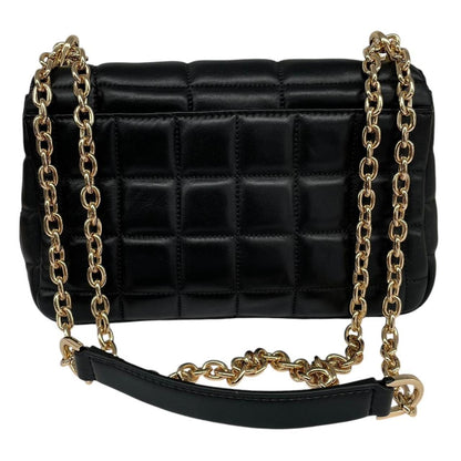 Michael Kors black duffel bag with quilted pattern and logo detail, pre-loved condition.