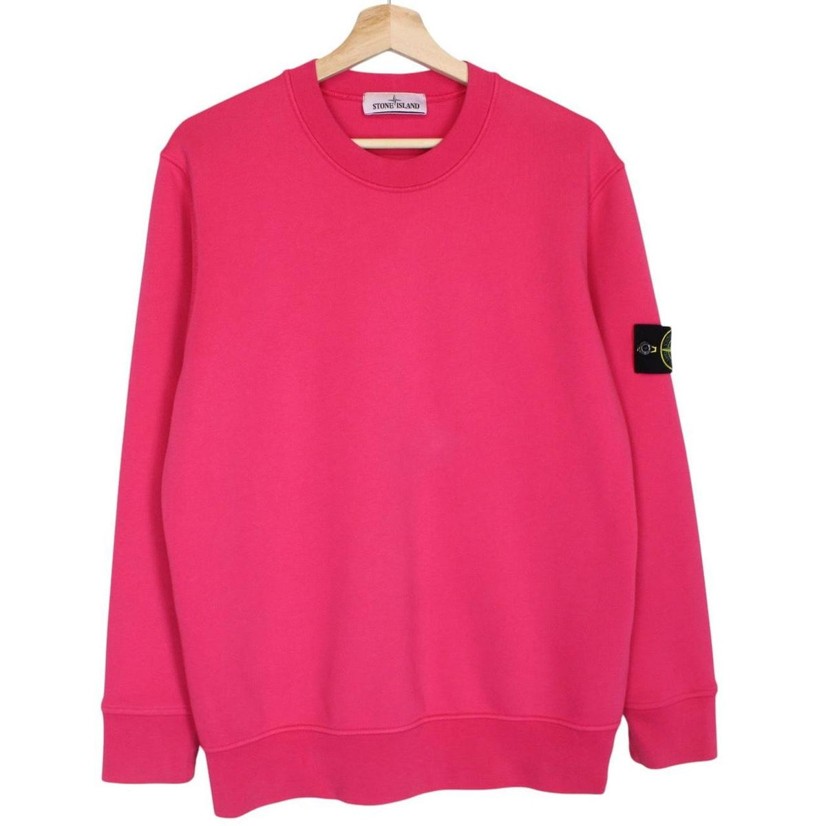 Stone Island pink sweatshirt cotton fabric with iconic compass logo on sleeve.
