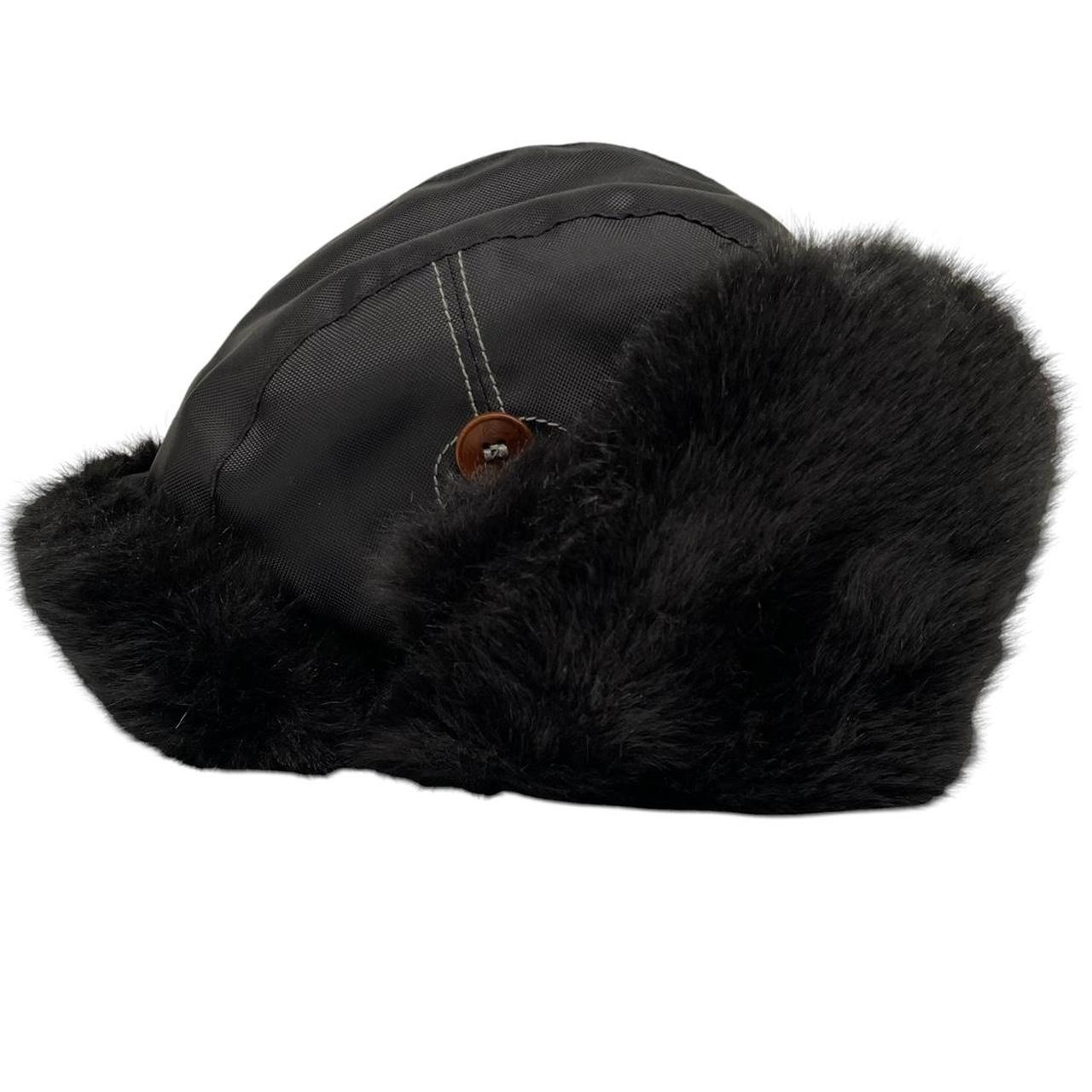 Paul Smith black nylon trapper hat with tags, featuring classic design and logo details.