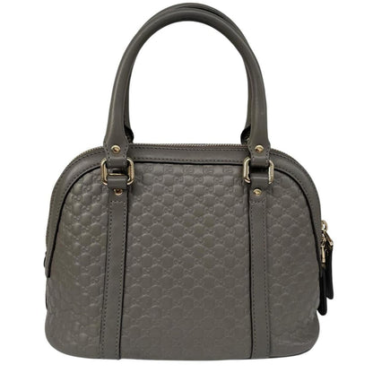 Gucci grey microguccissima mini dome shoulder bag with embossed logo and leather material.
