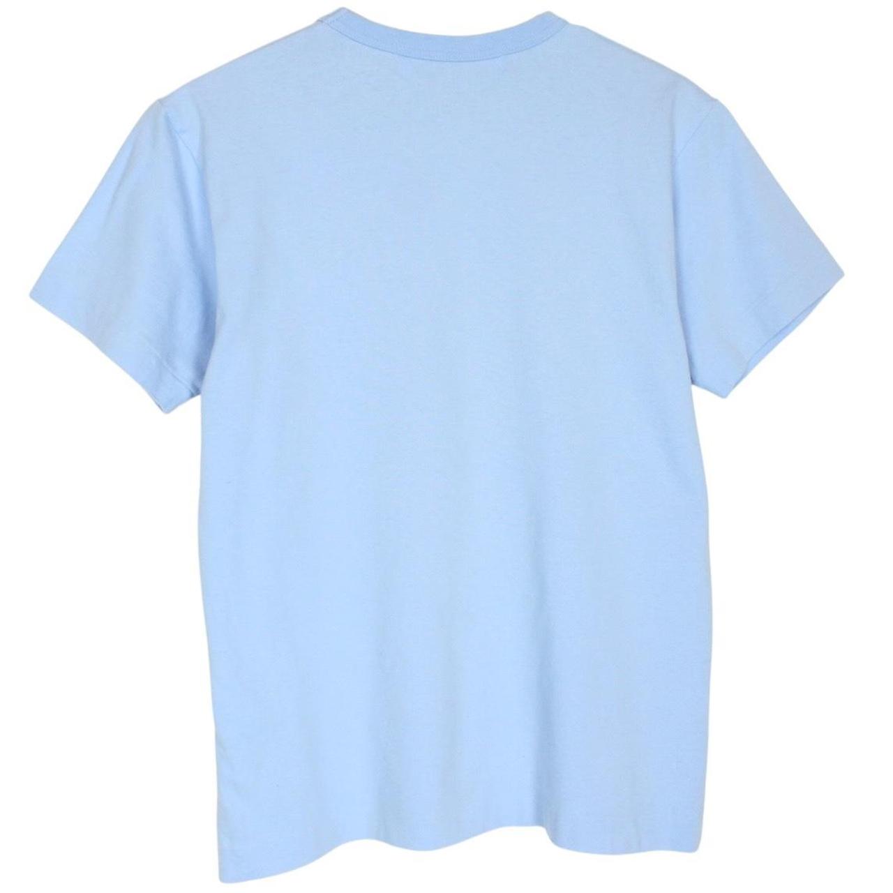 Comme des Garcons light blue short sleeve cotton t-shirt with heart logo and pocket.
